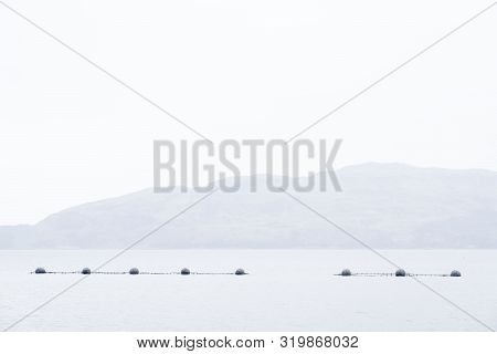 Fish Farm Salmon Nets Cages Floats In Sea Water Coast Environment Organic Farming At Loch Melfort Ar