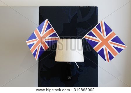 Union Jack Flag Hanging From Light Lamp In Hotel Room Uk