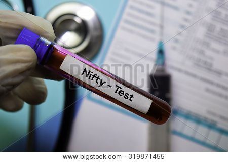 Nifty - Test With Blood Sample. Top View Isolated On Office Desk. Healthcare/medical Concept