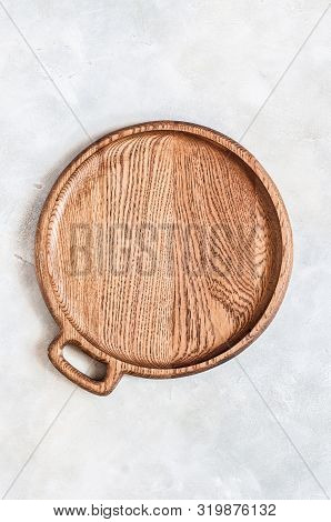 Empty Round Wooden Dish On Grey Concrete Background, Copy Space For Your Text