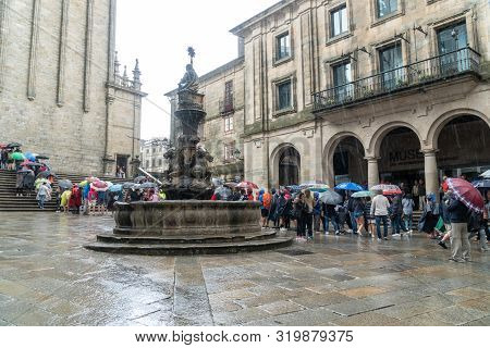 Santiago De Compostela, Spain; August 9, 2019: Pilgrims And Tourists Waiting In A Row To Enter To Sa