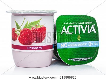 London, Uk - August 18, 2019: Cup Of Activia Exclusive Live Yogurt Cultures With Raspberries On Whit