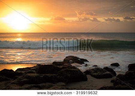 Seascape. Beach At Sunset. Bright Sunlight. Horizon Line. Beach With Rocks, Stones, Sand. Ocean With