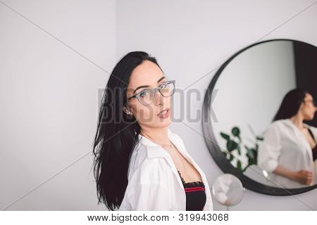 Fashion Luxury Lady In Man Shirt. Beauty Woman In Lingerie And Shirt Posing At Bedroom Near Mirror. 