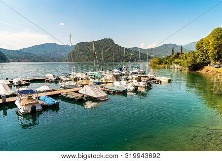 Pier With Boats On Lake Lugano In Morcote, Switzerland