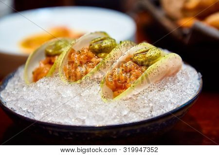 Ceviche Or Salmon Tartare In Daikon Slices.