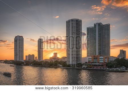 Sunset In The City Of Bangkok, Thailand. Chao Phraya River Embankment With Skyscreapers.
