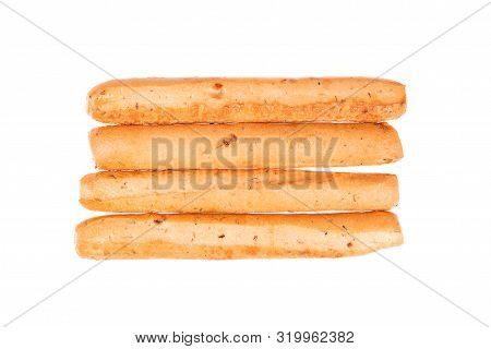 Bread Sticks Isolated On White Background. Grissini, Italian Breadsticks With Onions And Herbs. Top 