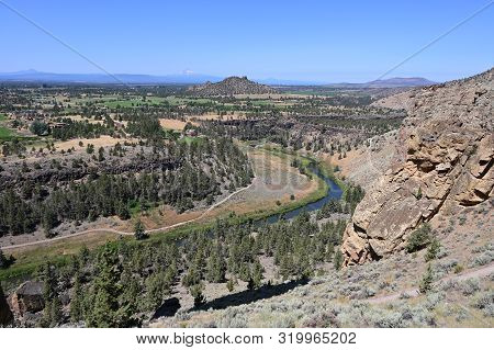 Smith Rock State Park And Crooked River Near Town Of Terrebonne, Oregon On Cloudless Summer Day.