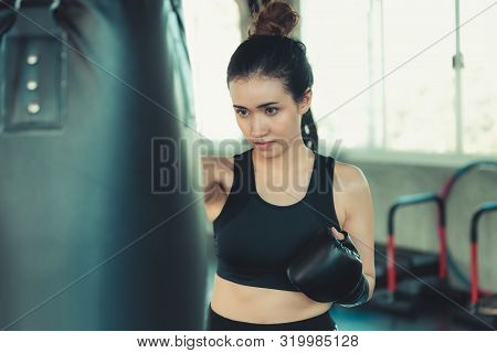 Female Sporty Boxer Is Exercised Training Punching In Fitness Club,portrait Of Boxing Woman Is Pract