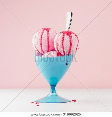 Seasonal Sweet Dairy Dessert - Pink Ice Cream Scoops In Elegant Blue Bowl With Strawberry Jam, Spoon