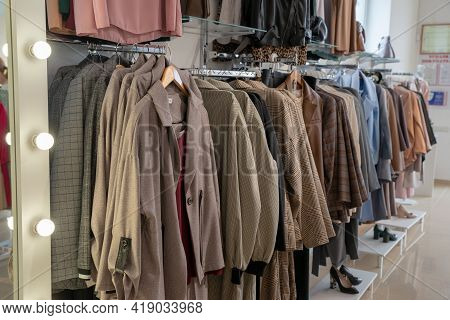 Stylish Collection Of Womens Clothing Hanging On Hangers In The Showroom. Copspace