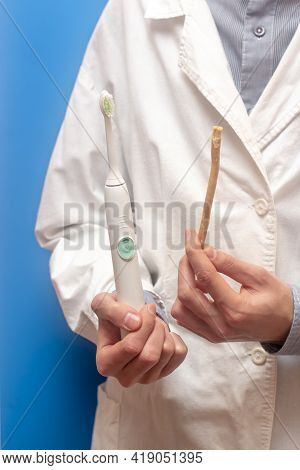 A Guy In A White Coat Holds A White Electric Toothbrush And Miswak Sivak , Arak Tree, Persian Salvad