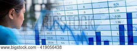 Woman doctor looks straigh ahead with many data and graphics background concept. digitally generated image.