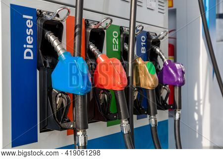 Fuel Pump, Gas Station, Gasoline. Colorful Petrol Pump Filling Nozzles Isolated On White Background 