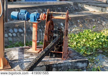 Metal Mechanical Gear On The Floodgate. Water Lock Gate Control Gears. Gears Of The River Flood Dam.