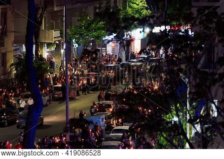 Thessaloniki, Greece - May 01 2021: Orthodox Easter 2021 Anastasi Resurrection. Faithful Wearing Fac