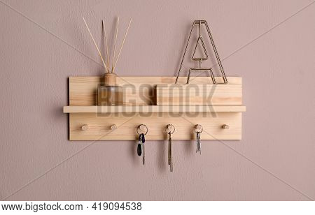 Wooden Hanger For Keys On Color Wall