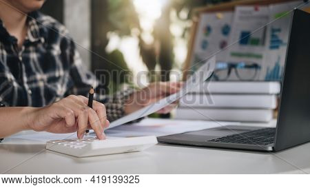 Close Up Of Woman Calculate On Calculator Manage Family Budget Make Payment On Computer. Female Busy