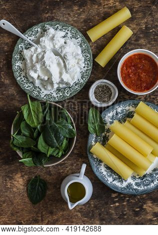 Ingredients For Cooking Fresh Cannelloni Pasta With Spinach And Ricotta Baked With Mozzarella Cheese