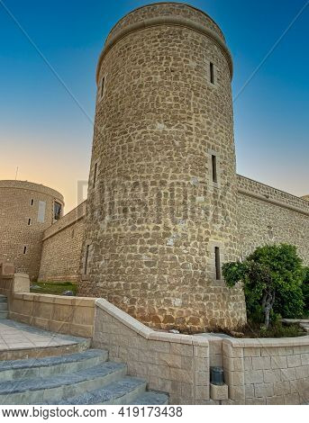 Restored Stone Tower In Gardens. Roquetes De Mar In Spain