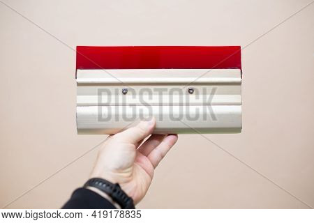 Hand With Squeegee For Serigraphy Silk Screen Print Process At Clothes Factory