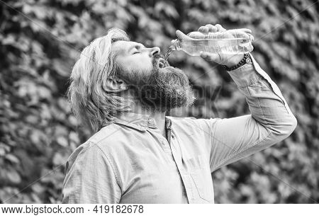Another Sip. Handsome Man Drinking Fresh Water From Bottle. Morning Routine. Daily Intake Of Water. 
