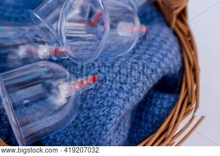 Jars For Hijama In A Basket In The Snow. Wicker Basket. Bloodletting According To The Sunnah. Vacuum