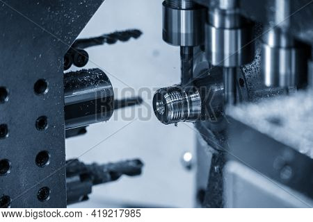 The  Operation Of Multi-tasking Cnc Lathe Machine Swiss Type Tapping On The Pipe Connector Parts. Th