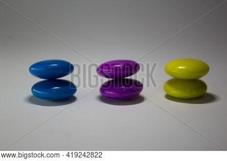 Close Up Of Gems Chocolate Candy With White Background