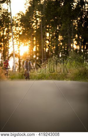 Happy couple riding bicycles outside, healthy lifestyle fun concept, taking a break admiring the view