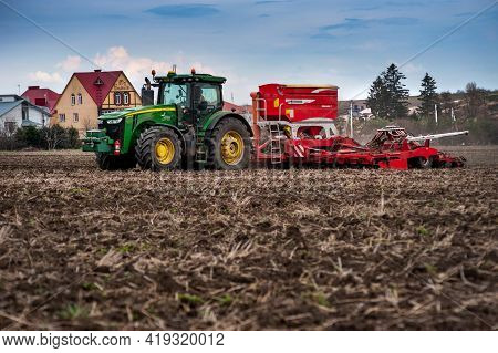 Baykivtsi, Ternopil Region, Ukraine - April 20, 2021: Farmers Sow, Apply Fertilizer Using A John Dee