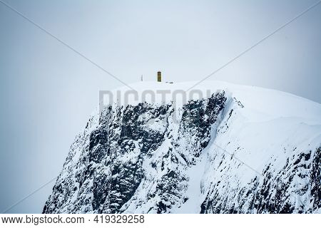 Mount Bitihorn Peak In Beitostølen Norway, Covered In Snow On A Cold Winters Day.