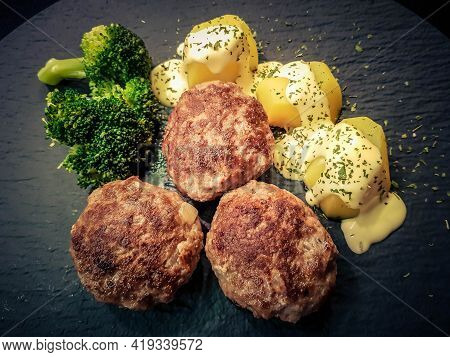 Fried Meatballs With Boiled Broccoli And Parsley Potatoes