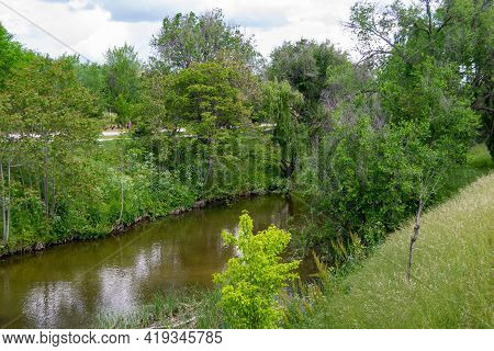 The Manzanares River As It Passes Through A Park In The Community Of Madrid, In Spain. Green Trees O