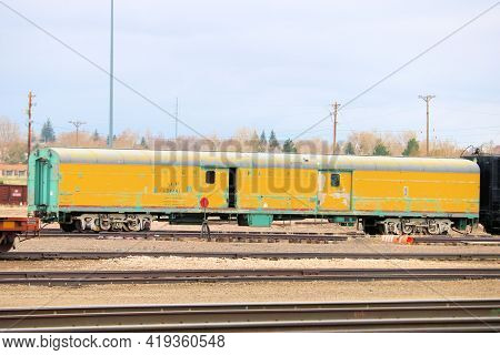 April 26, 2021 In Cheyenne, Wy:  Vintage Rail Car On A Railroad Track At The Rail Yard Taken In Chey