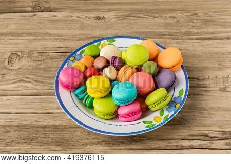 Colorful Macarons Dessert With Vintage Pastel Tones. Colorful French Macarons Background, Different 