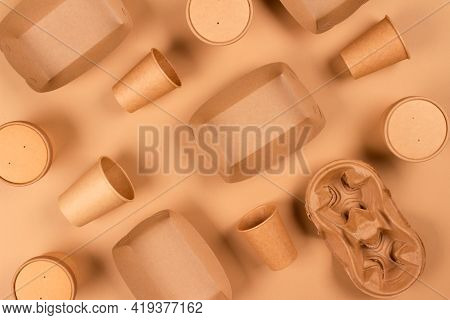 Flat Lay Composition With Eco-friendly Tableware And Kraft Paper Food Packaging On Kraft Paper Backg