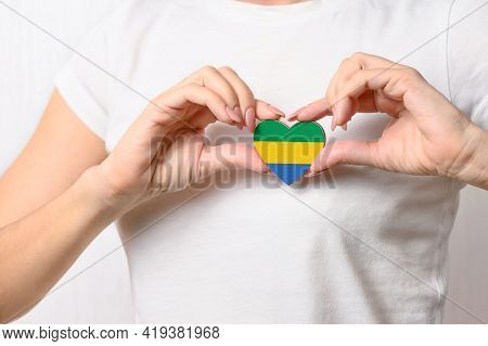 Flag Of Gabon In The Shape Of A Heart In The Hands Of A Girl. Love Gabon. Respect For The People Of 