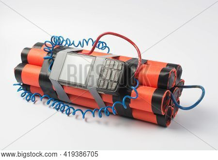 Ready Assembled Bomb With A Clockwork From An Old Smartphone Rewound With Electrical Tape On A White