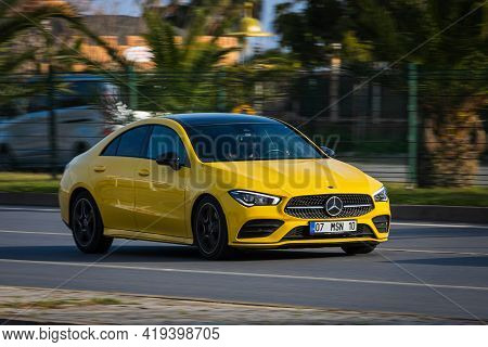 Alanya, Turkey  - April 17  2021:   Yellow Mercedes-benz Cla-class    Is Driving Fast On The Street 