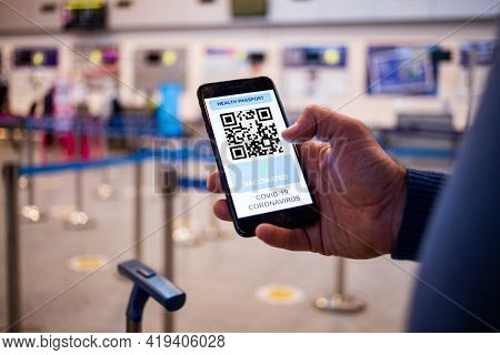 health Vaccine Passport for Coronavirus or Covid-19. Traveller Using Mobile Phone with Vaccination in Immune Status to Certificated International Traveling in Airport