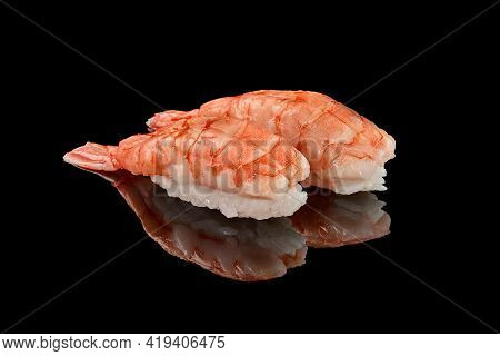Two Shrimp Nigiri Sushi On Black Background With Reflection