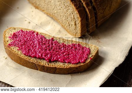 A Piece Of Bread And Fresh Horseradish Sauce With Beets. A Slice Of Rye Bread With Hot Sauce. An Ang