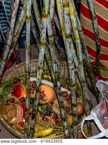High Angle Shot Of Sugarcane Made Poles Covering Fruits And Other Offerings For Chath Pooja