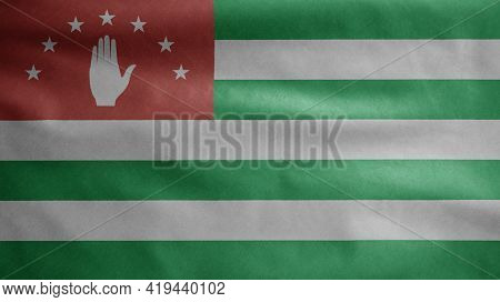 Abkhazian Flag Waving In The Wind. Close Up Of Abkhazia Banner Blowing Soft Silk