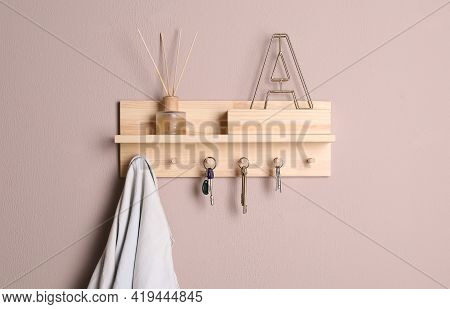 Wooden Hanger For Keys On Color Wall
