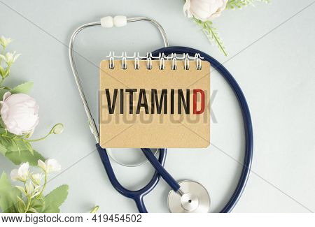Vitamin D Word On Notebook, Stethoscope And Green Plant