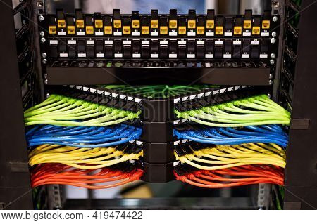 Multi-colored Rows Of Network Cables Are Connected To The System