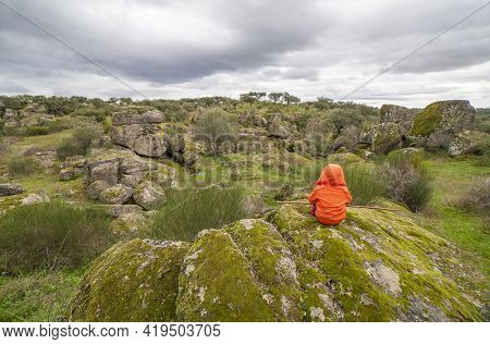 Child Boy Observing Spectacular Granitic Landscape Of Cornalvo Natural Park, Extremadura, Spain